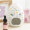 Quemador de aceite y calentador de cera con forma de huevo y estampado floral primaveral
