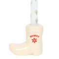 Candelabro de bota de vaquero blanca con vela cónica