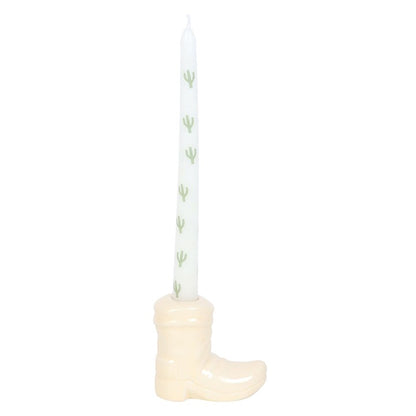 Candelabro de bota de vaquero blanca con vela cónica